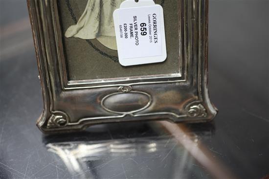 An Edwardian Art Nouveau repousse silver photograph frame, 11.25in.